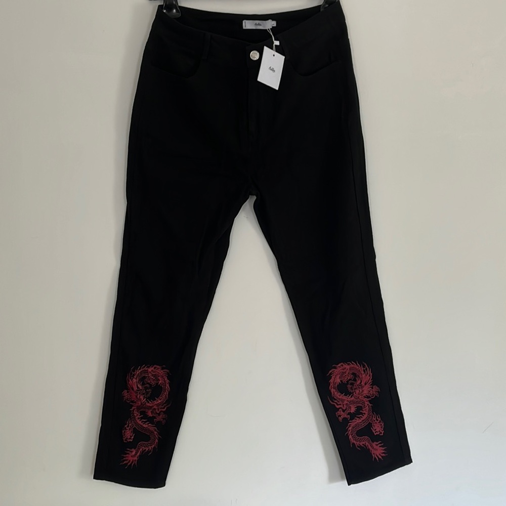 black adika jeans with dragon design